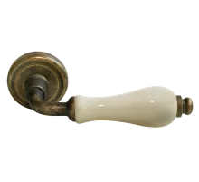 Ручка дверная CERAMICA CC-3 OBA/CHAMP раздельная на круглой розетке, цвет античная бронза/шампань, латунь
